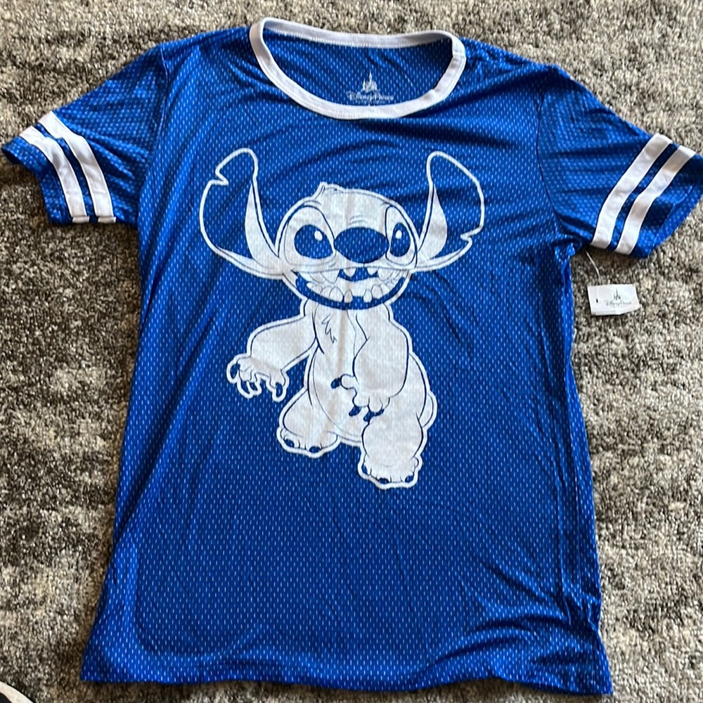 Brand new Disney tshirt featuring Stitch. Still has tag from Disney attached.
